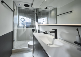 s65-interior-owners-stateroom-bathroom-silver-oak-satin.jpg